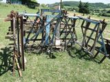 a lot of old farm equipment in the field