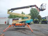 a crane that is sitting in the middle of a parking lot
