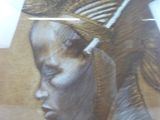 a picture of a woman with a feather on her head