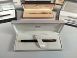 a box with a pen in it and a box with a pen in it
