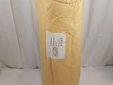 a large roll of gold tissue sitting on a white surface