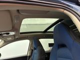 the interior of a car with the door open and the seats down