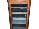 an image of a wooden cabinet with glass doors and shelves