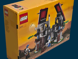 a box with a lego castle on it on a blue background
