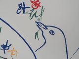 a drawing of a bird on a piece of paper with a child ' s drawing on it