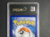 the pokemon card is in the plastic case on the table