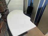a white table in the middle of a room