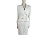 an image of a mannequin wearing a white suit and skirt