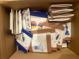 a cardboard box filled with many different types of papers