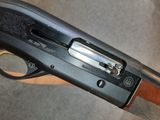 a close up of a shotgun with a gun on it ' s side