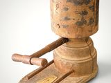 an old wooden hammer with a wooden handle on a white surface