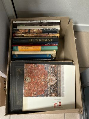 a box full of books sitting on the floor