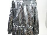 a silver sequinized coat on a mannequin mannequin mannequin mannequin mannequin mannequin mannequin mannequin