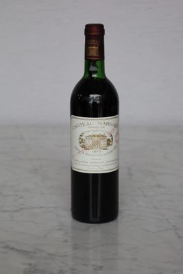 a bottle of wine that is sitting on a table