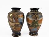 two vases sitting side by side on a white surface