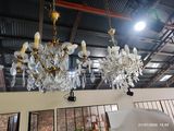 a chandelier hanging from the ceiling in a room