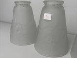 three vases that are sitting on a shelf