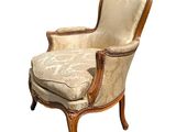 an image of a chair with a beige upholstered seat