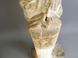 a statue of a man sitting on top of a toilet