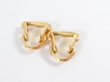 two pairs of gold plated earrings on a white surface