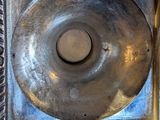 a picture of a metal object in a silver frame