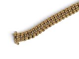 gold chain bracelet on white background with copy space for text