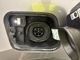 a close up of a car ' s fuel pump with a sticker on it