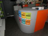 a counter that has a lot of stickers on it