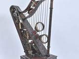 a musical instrument that is sitting on top of a wooden stand
