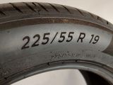 a close up of a tire on a white surface with a number on it