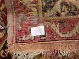 an image of a close up of a rug with a tag on it