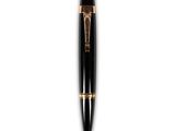 a close up of a pen on a white surface with a white background
