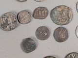 a lot of coins that are on the table