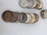 a lot of coins that are on the table