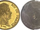 a close up of a coin with a face on it