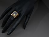a close up of a person ' s hand with a ring on it ' s finger