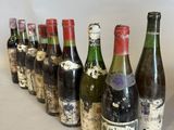 several bottles of wine lined up in a row on a table