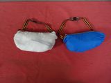 pair of blue and white purses on a red surface