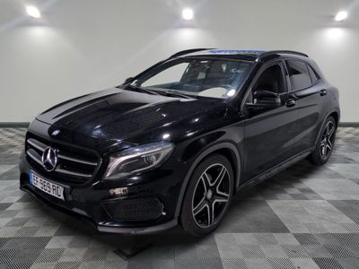 the mercedes gla suv is parked on a checkered floor