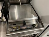 a stainless steel counter top with a dishwasher in it