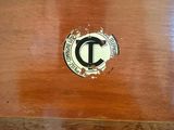 a close up of a wooden box with a logo on it