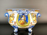 a blue and white bowl with a picture of a woman on it