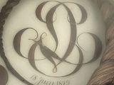 a picture of a cake with a monogram on it