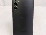 a close up of the back of a black cell phone