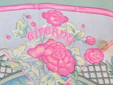 a picture of a pink purse with flowers on it