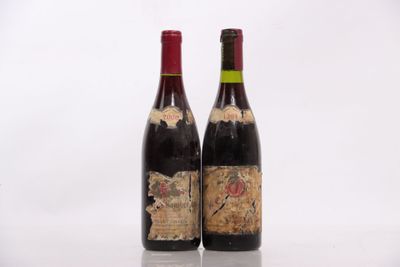 two bottles of wine sitting next to each other on top of a table