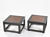 pair of black and brown side tables on a white background