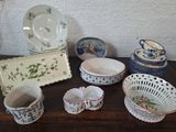 many different types of dishes and bowls on the table
