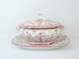 an image of a tureeny dish and saucer