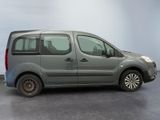 the grey van is parked on the concrete floor in the room